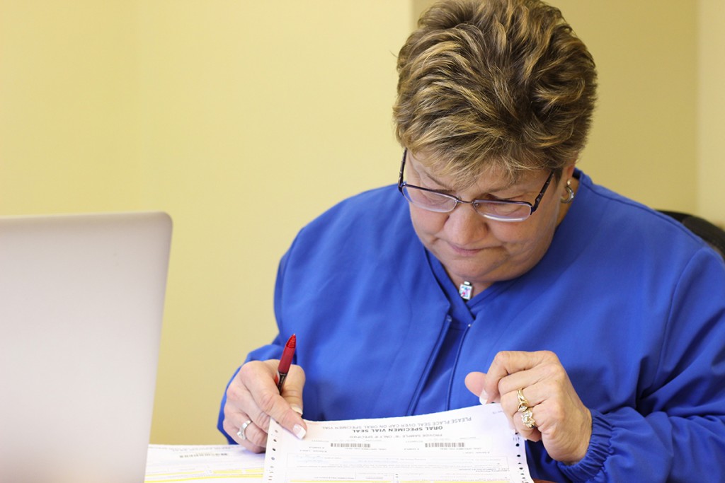 Woman reviewing paperwork at a desk