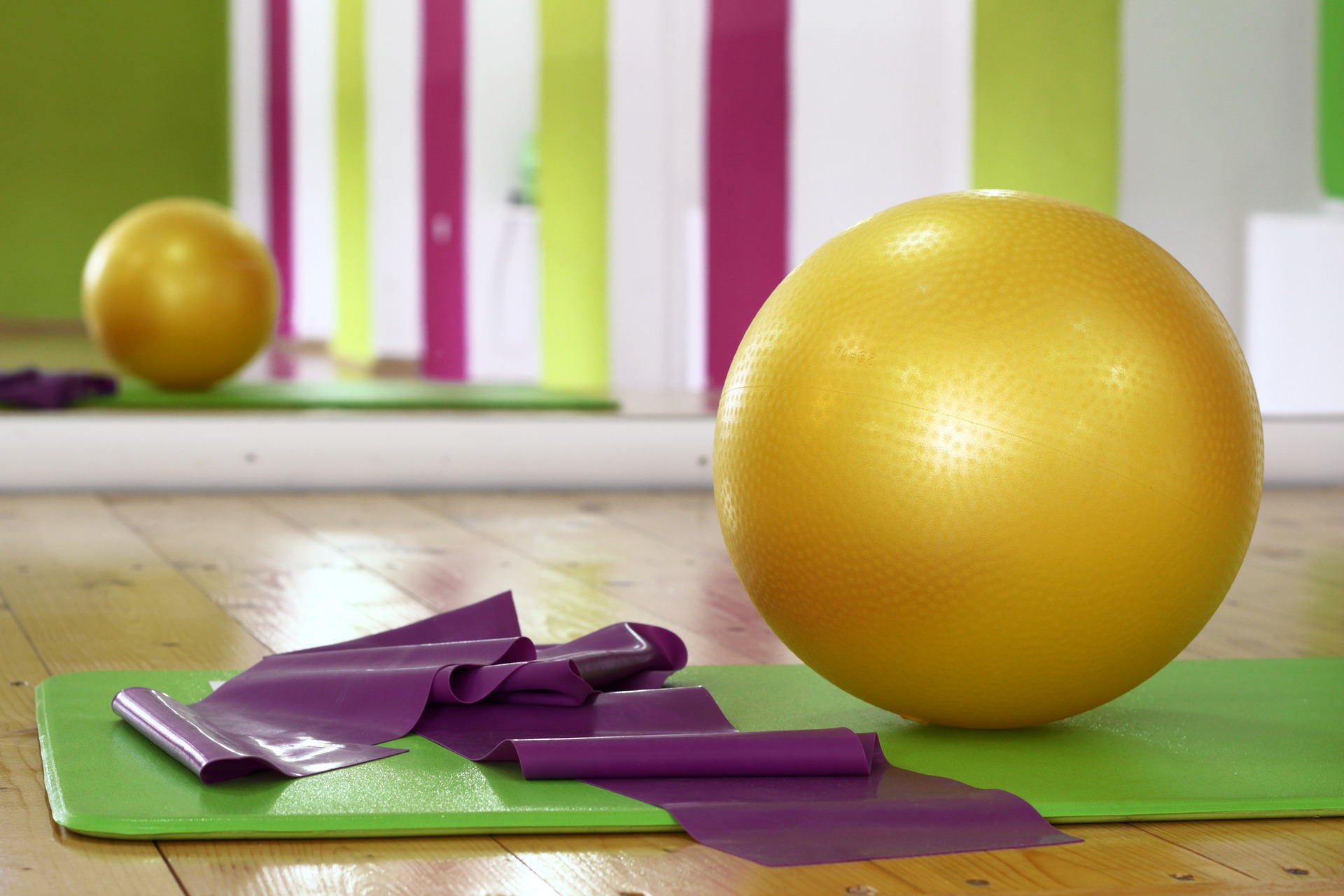 Yoga mat, strap and ball ready for yoga class offered as an alternative employee benefit