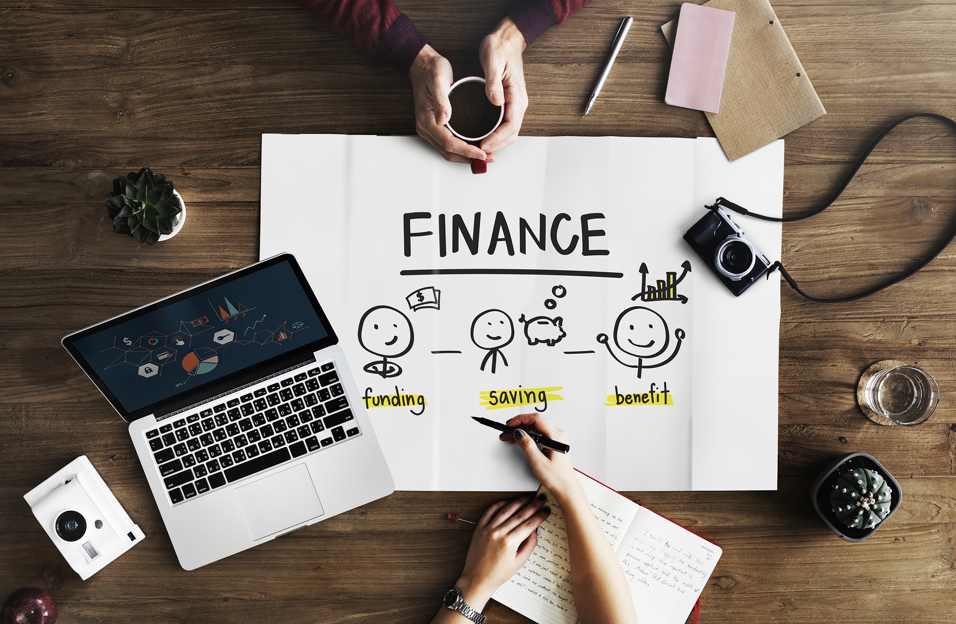 Work supplies and financial planning sheet on table