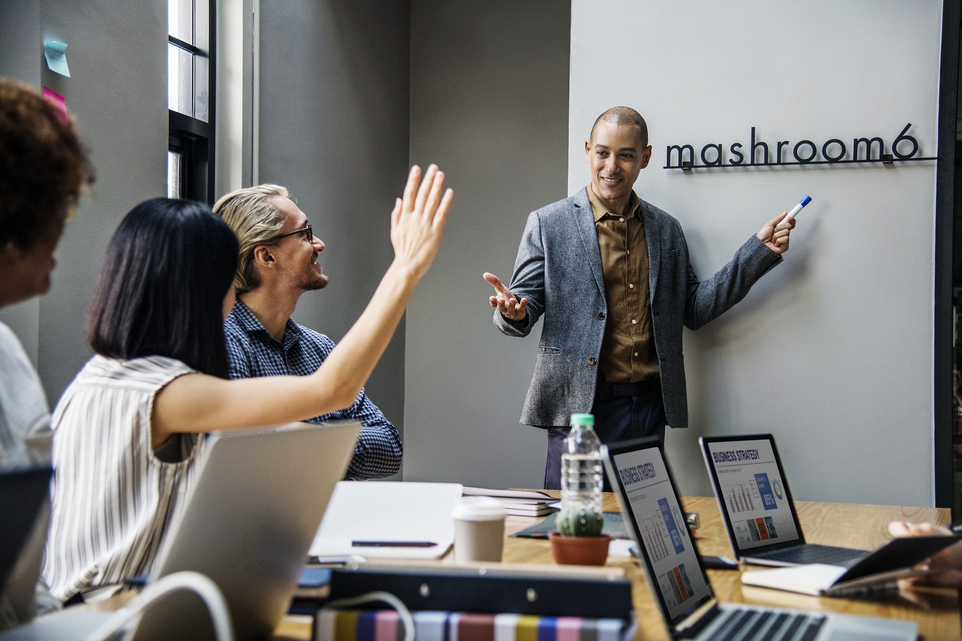 People around conference table to brainstorm corporate health fair ideas