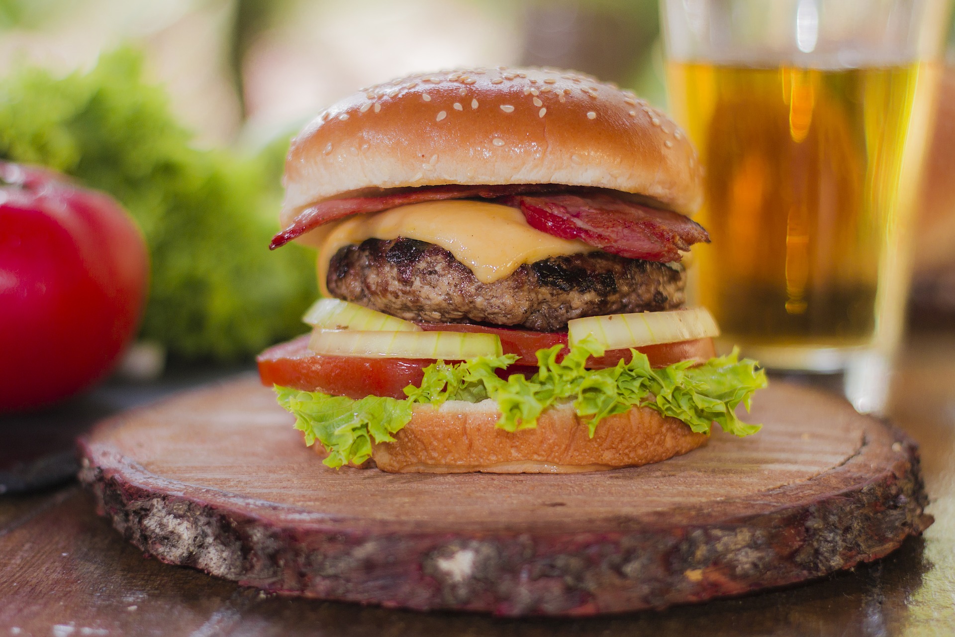 Hamburger on wooden tray to demonstrate bad cholesterol